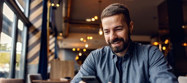 man looking at phone