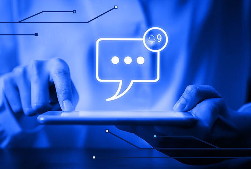 Fingers typing with talk bubble