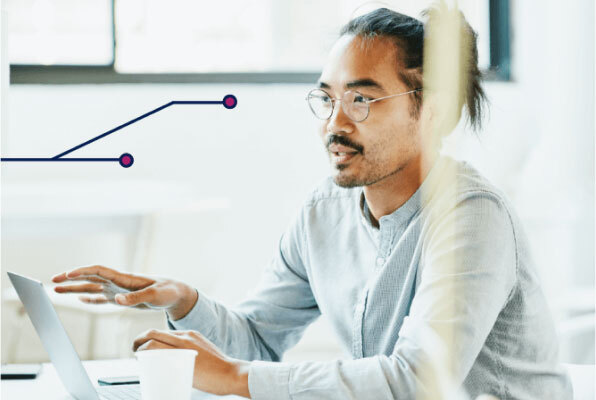 Man Talking While Sitting in Front of Laptop