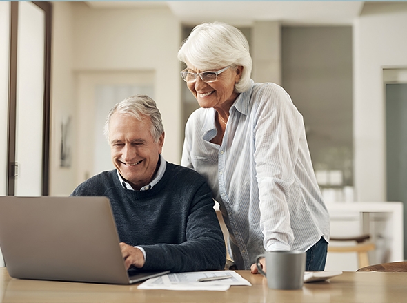Older couple looking at laptop