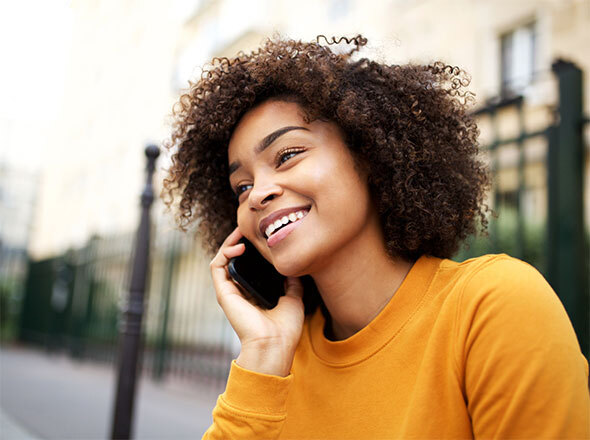 Girl smiling talking on cell phone