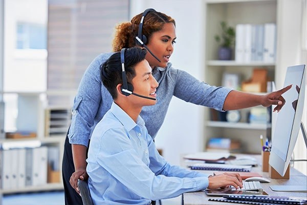 Telecom two people working min